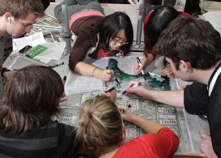 Six students color in landscape architecture design plans