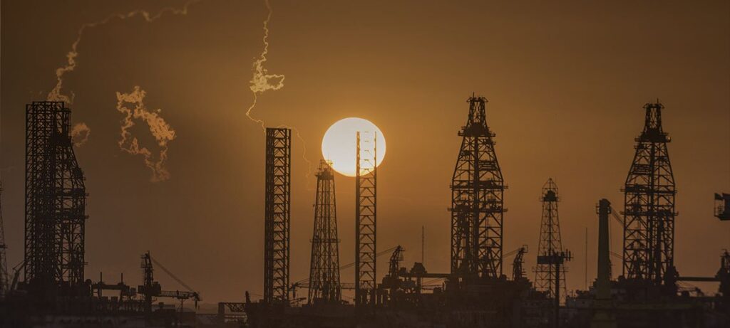 Sun sets behind oil barracks