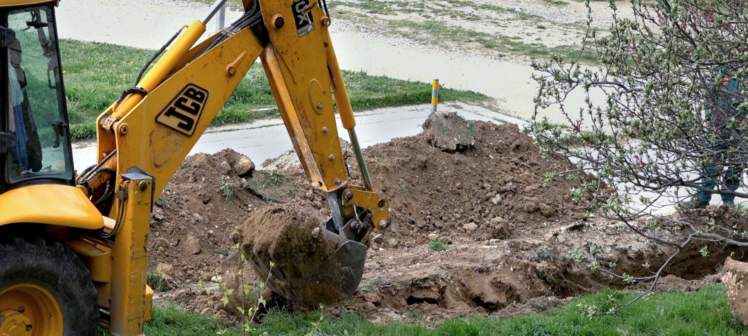 An excavator removes dirt at a job site