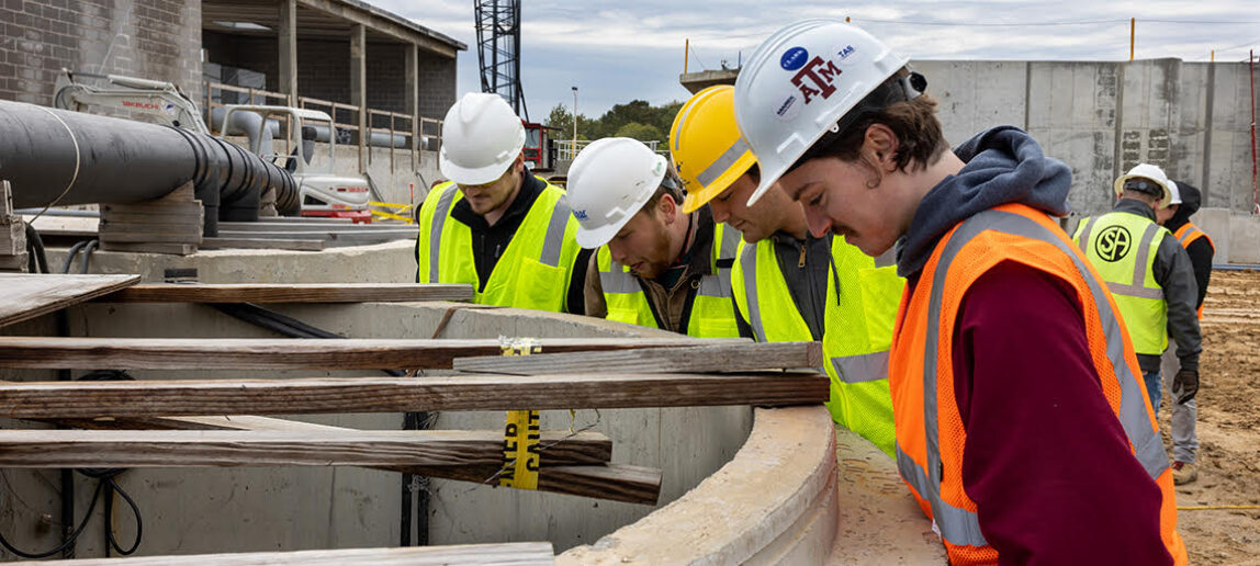 Construction Science Students look at work site