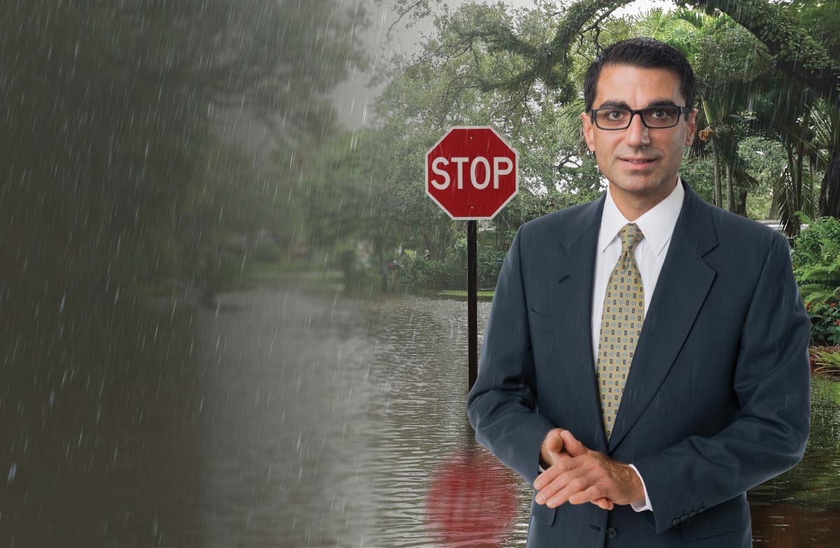 Amir Behzedan in front of flooded street