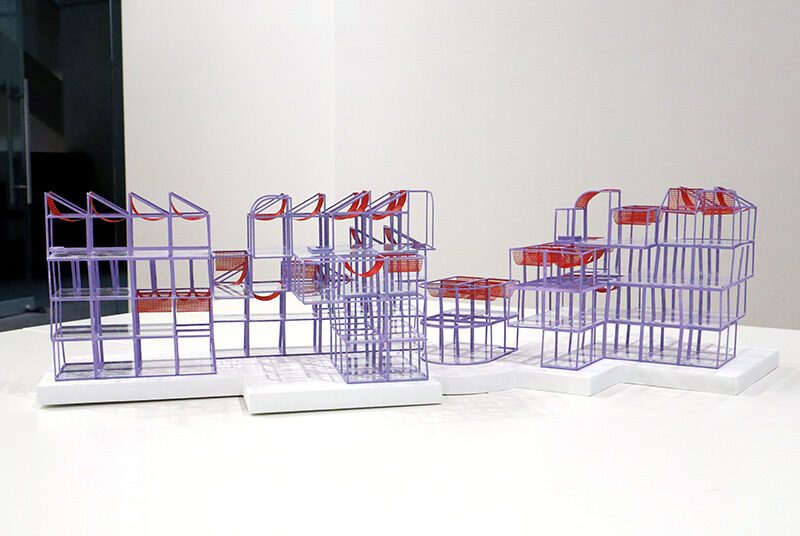 A close up view of a purple and red 3D geometric student project from School of Architecture.