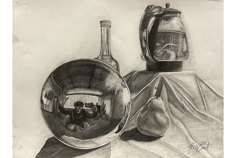 A still life drawing of a reflective sphere, a glass bottle, a pear, a kettle, and draped fabric. On the sphere, there is a reflection of a student with his arms out taking a photo with a smartphone.