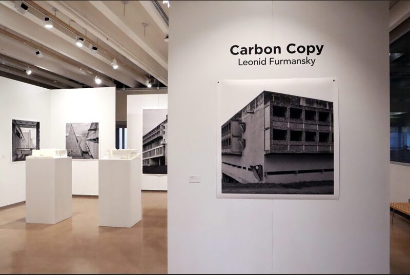 Print of Leonid Formansky’s “La Tourette Convent #0” on a white wall with “Carbon Copy Leonid Formansky” above it in black vinyl letters.