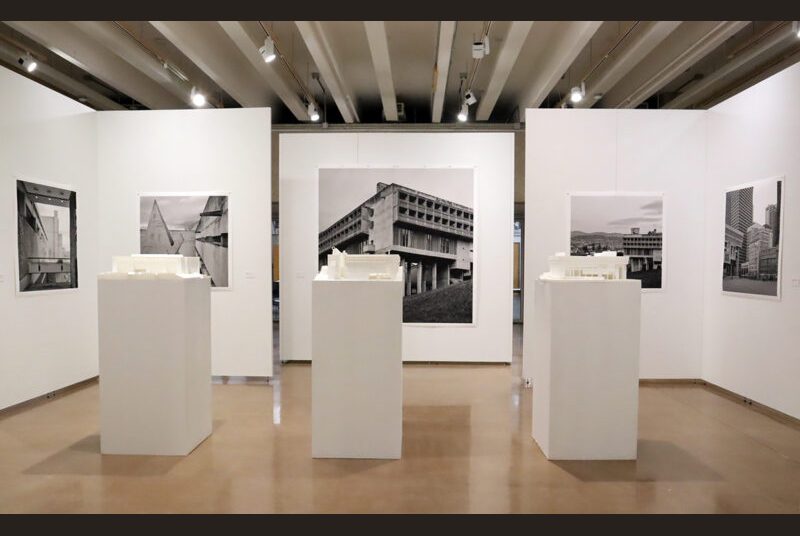 Three pedestals with 3D-printed models of (from left to right): Texas A&M’s Langford Building, La Tourette, and Boston City Hall.