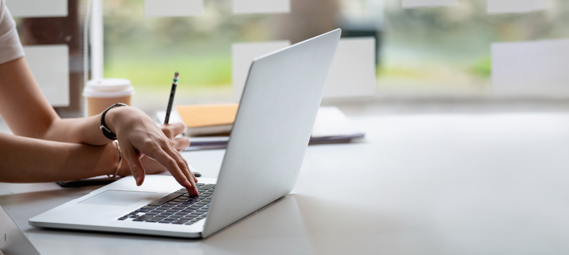 An image of a person working on a laptop.