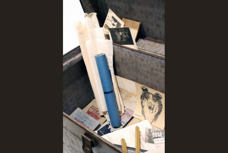 Memorabilia belonging to the architect such as drawings, drafting tools, photographs on A&M campus and Aggie student handbooks.