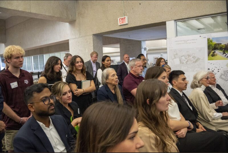 Reviewers, family members, and community leaders are attending the review.