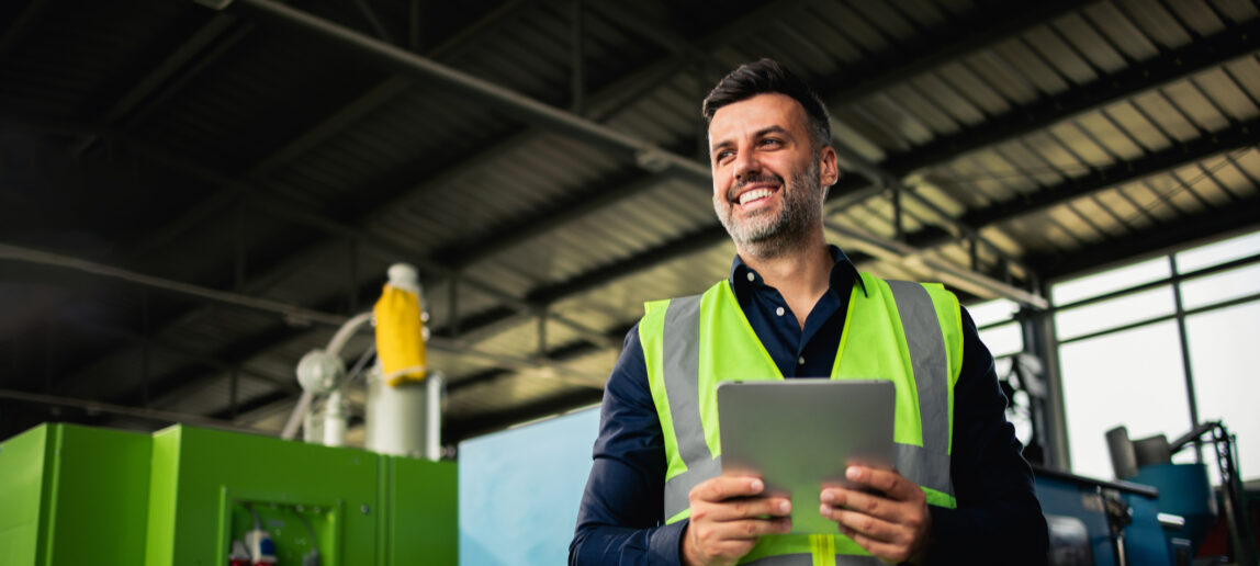 Portrait of a happy manager from the factory