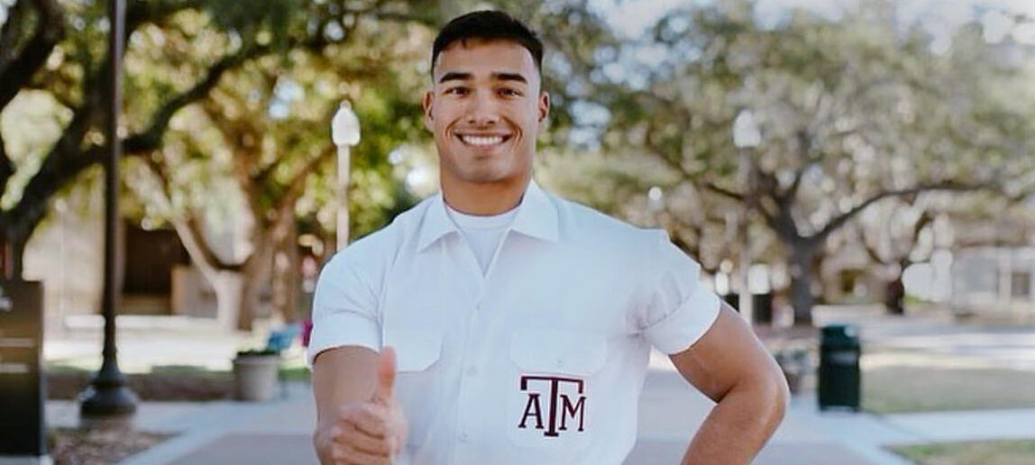 Yell Leader Zac Cross gives the gigs in front of Military Walk