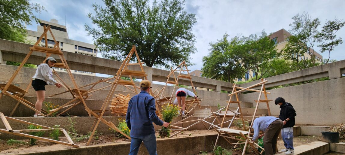 Group of students working on bird installation